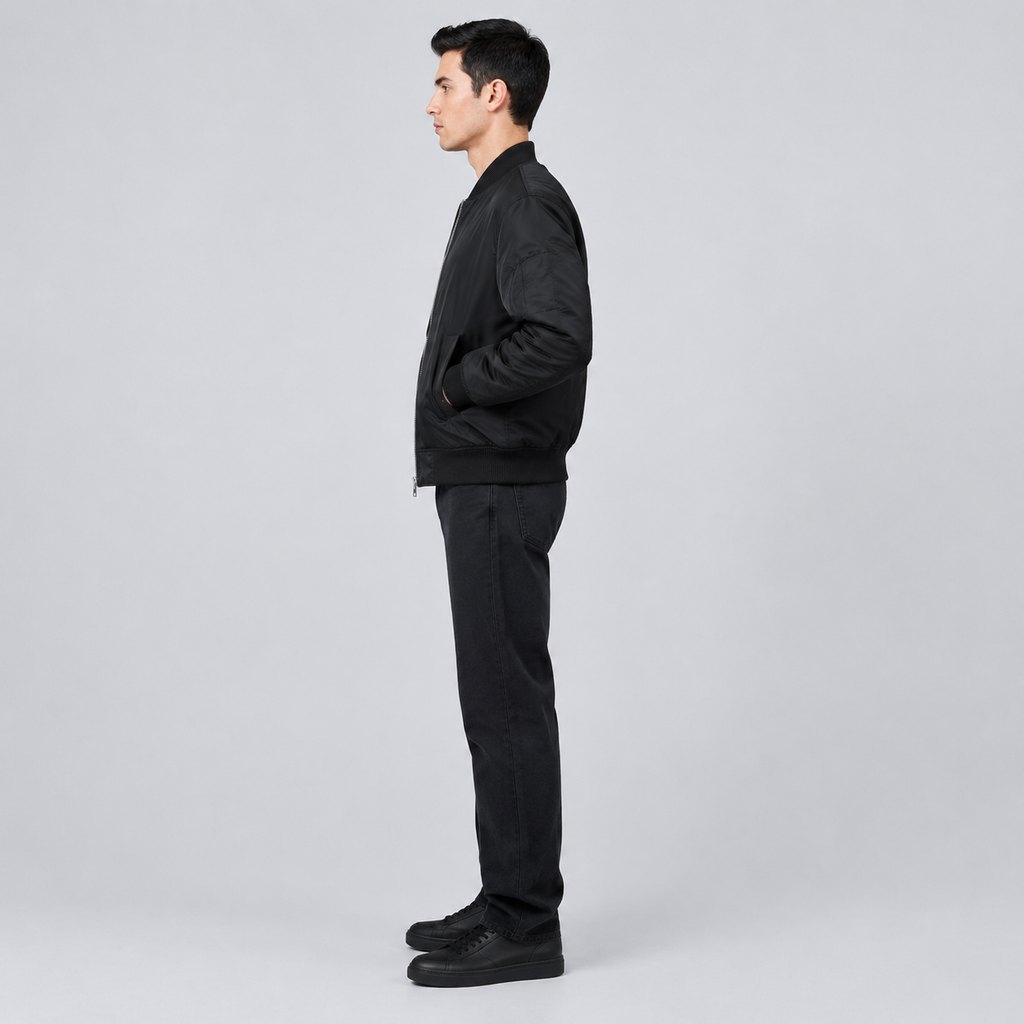 Black MA-1 bomber jacket worn by a model, front view — view 3