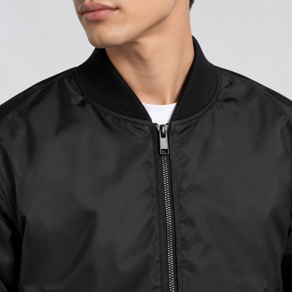 Black MA-1 bomber jacket worn by a model, front view — view 5
