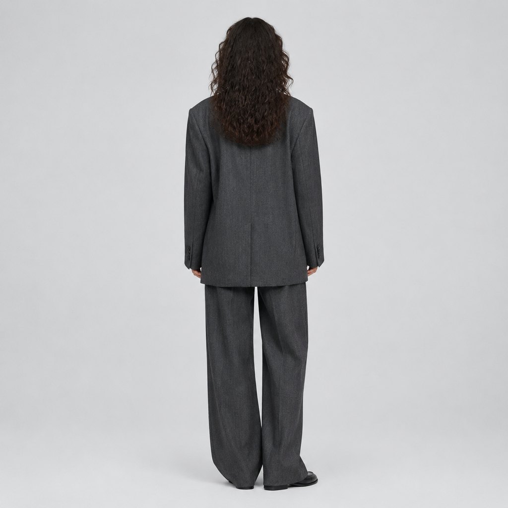 Oversized charcoal blazer worn by a model, front view — view 4
