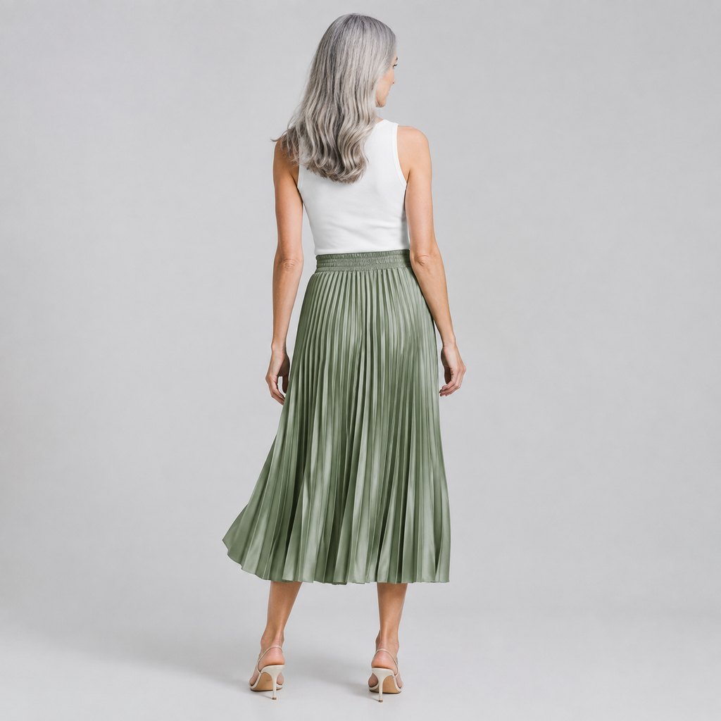 Sage green pleated midi skirt worn by a model, front view — view 4